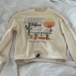 Cute cream crewmeck in size small!
